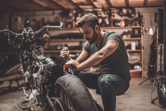 man-working-on-motorcycle