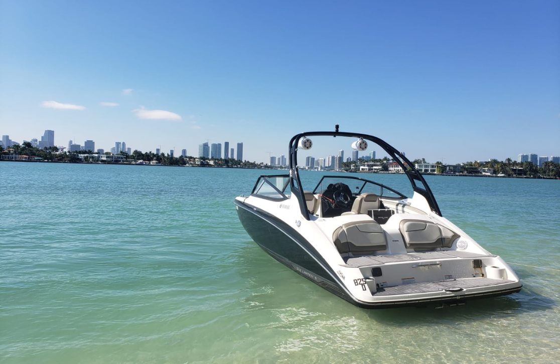 boat with speakers parked facing into the ocean