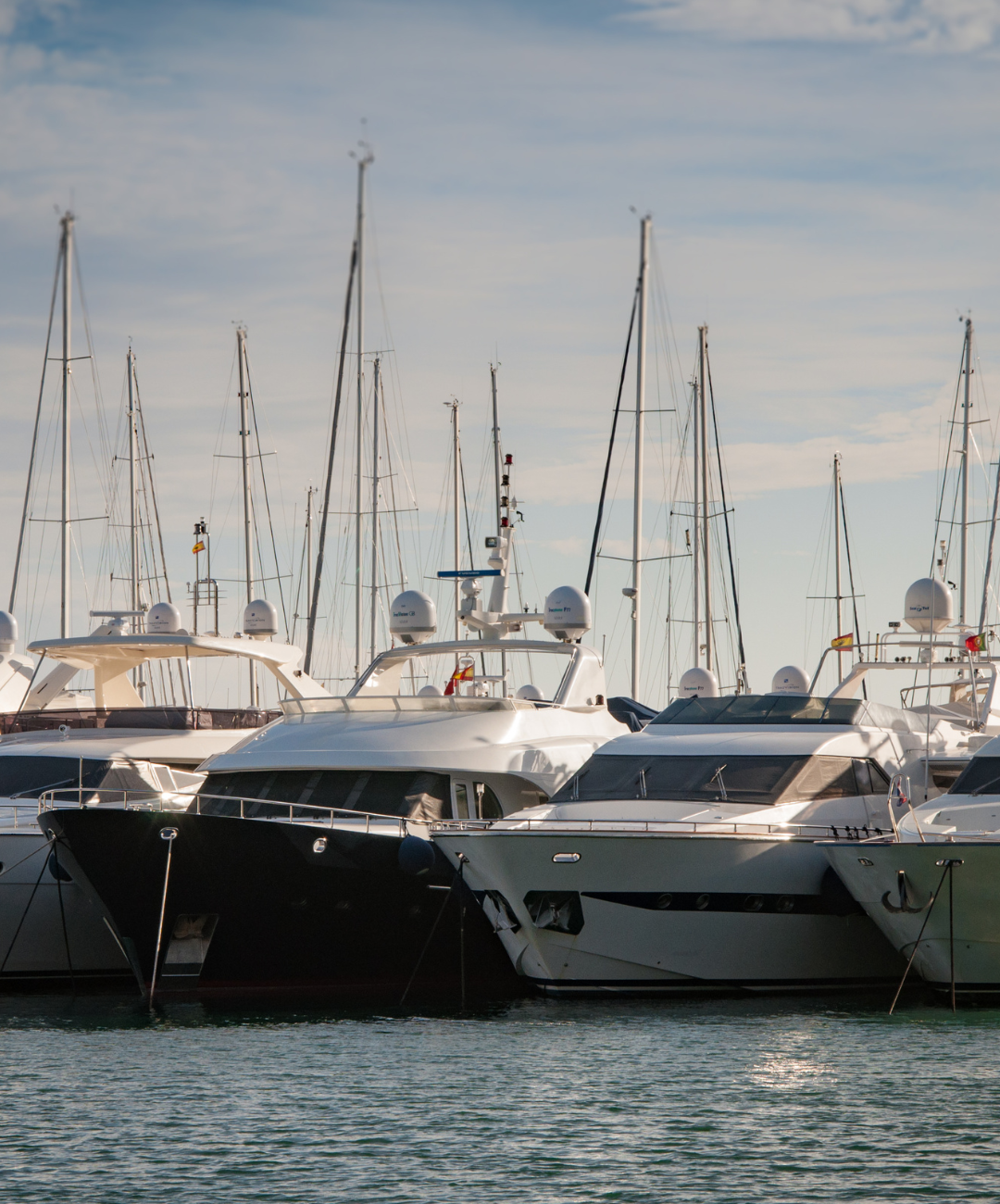 large yachts parked next to each other in a line
