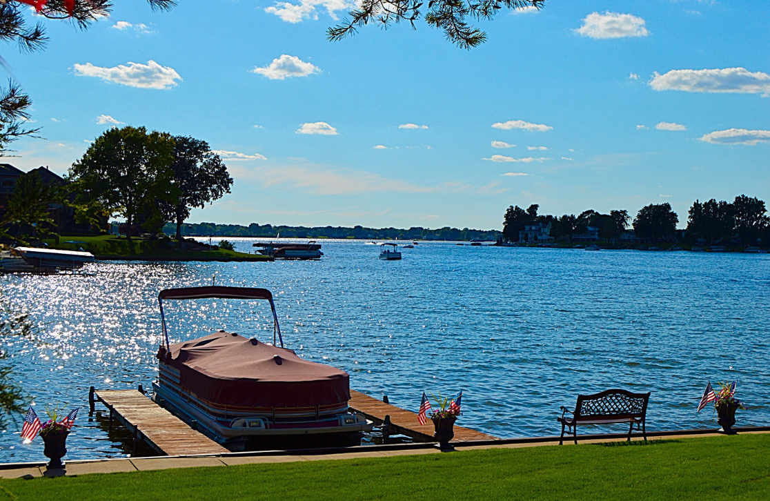 boat docked at a lake house