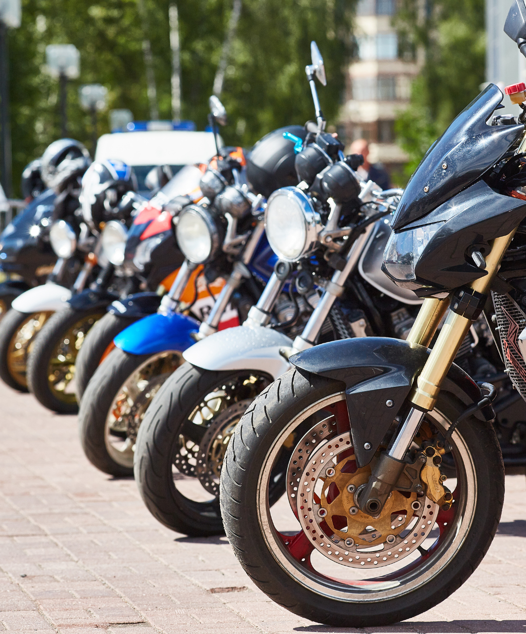 line of motorcycles parked together 